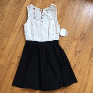 Brand new sleeveless dress with flower print top